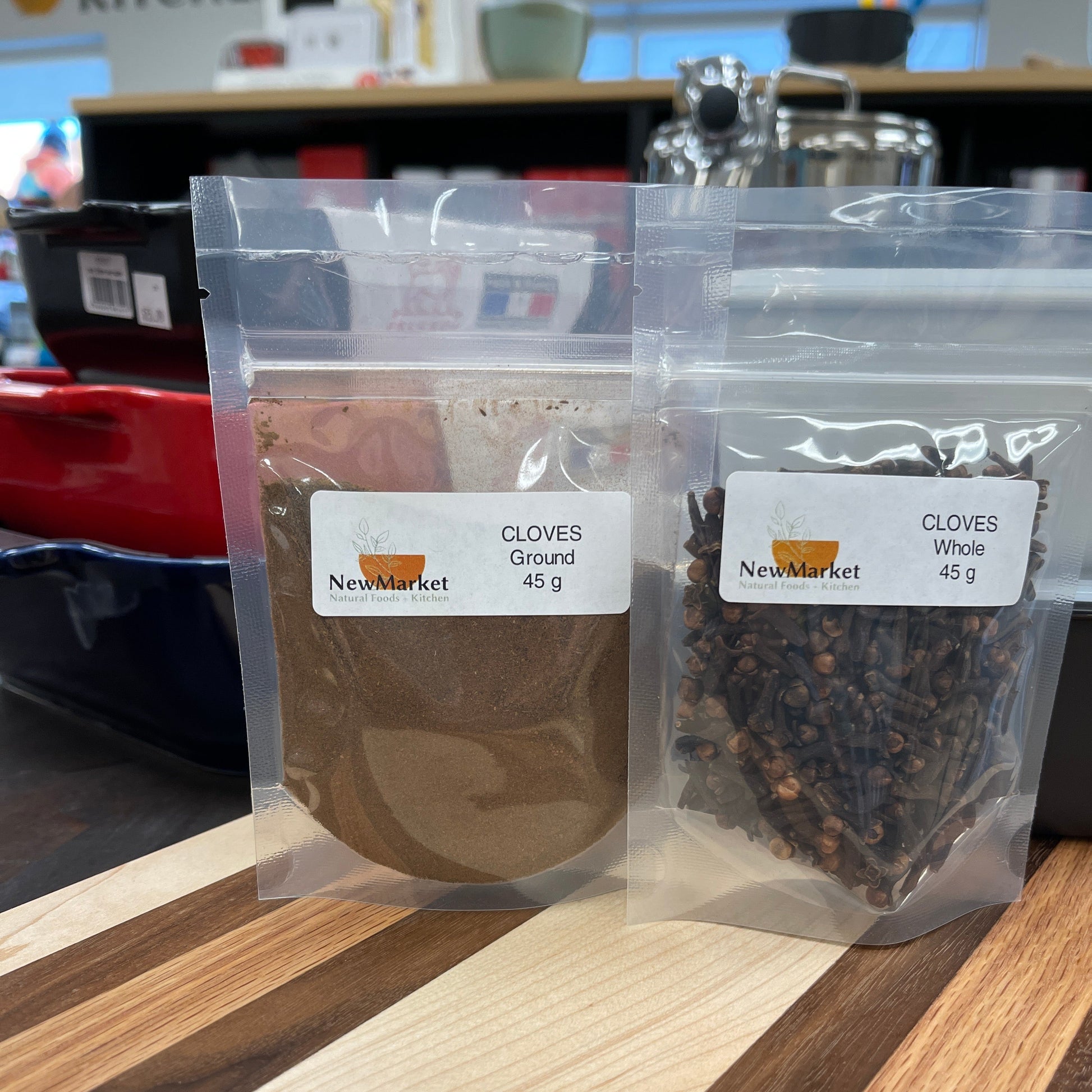 Packaged cloves on a shelf with a label in the foreground